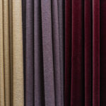 Set of multi-colored dense fabrics of uniform texture, choice of materials in different colors.