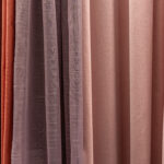 Set of multi-colored dense fabrics of uniform texture, choice of materials in different colors.